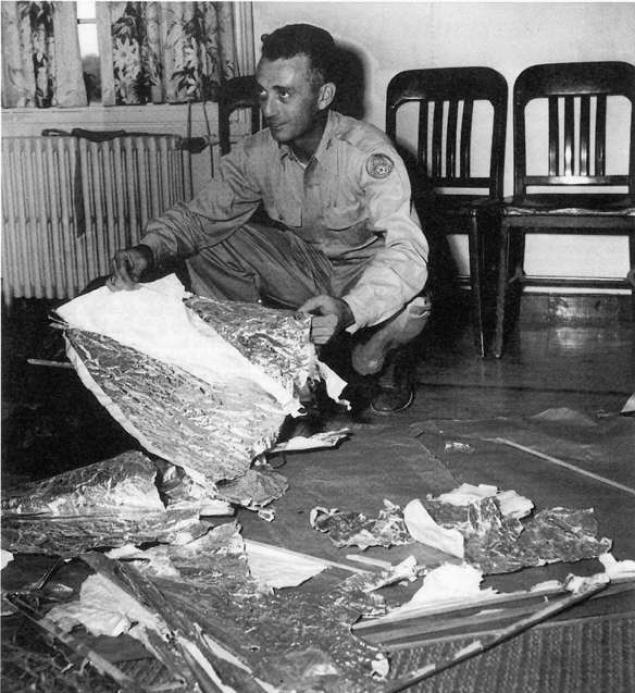 Photograph of Army Guy Sorting Through Roswell Debris - flying saucer- vintage- 1948